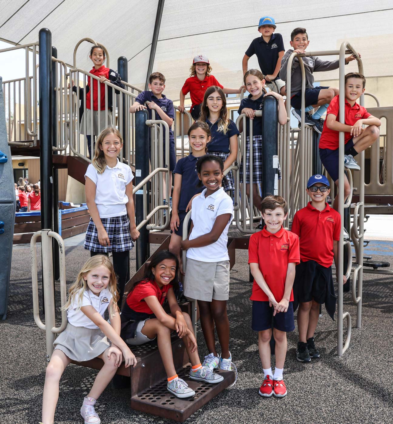 Group of Friends Christian School students in uniform posing together on the playground