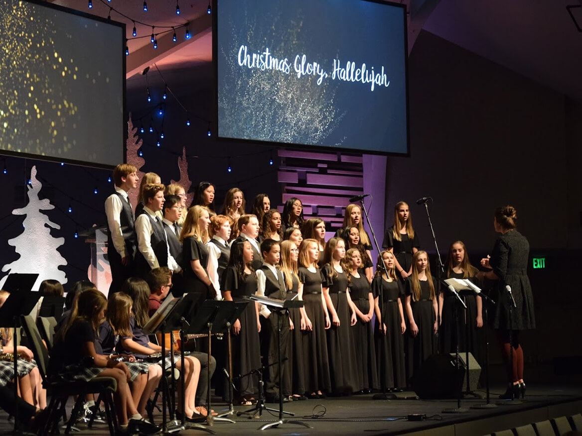 School choir in black performing at a Christmas concert